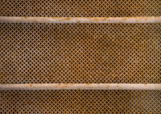 istock Grunge mesh background. Rusty metal lattice or grid on building window. Abstract reticulate texture or pattern 1266235679