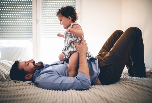 istock A father plays with his baby daughter in quarantine 1266237246