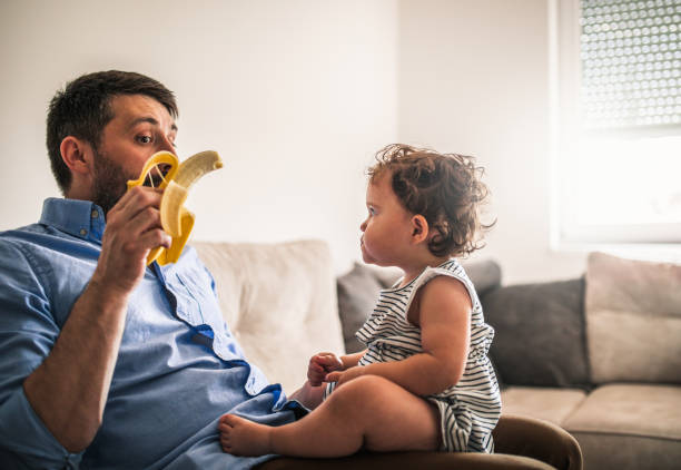 istock A father plays with his baby daughter in quarantine 1266237255