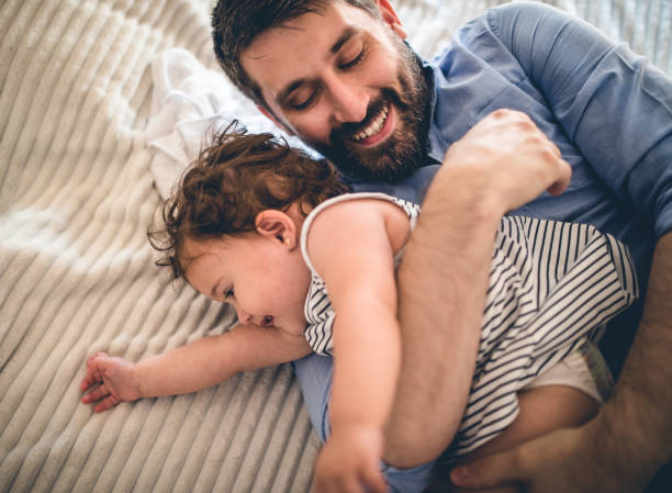 istock A father plays with his baby daughter in quarantine 1266237470