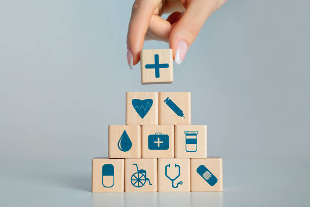 istock Female hand arranging wood block stacking 1266237493