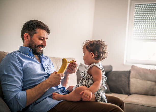 istock A father plays with his baby daughter in quarantine 1266237596
