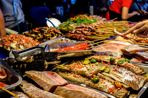 Turo-turo paluto Night Market in Baguio City, Philippines. You choose from the fresh seafood and meet and they will cook it for you.
