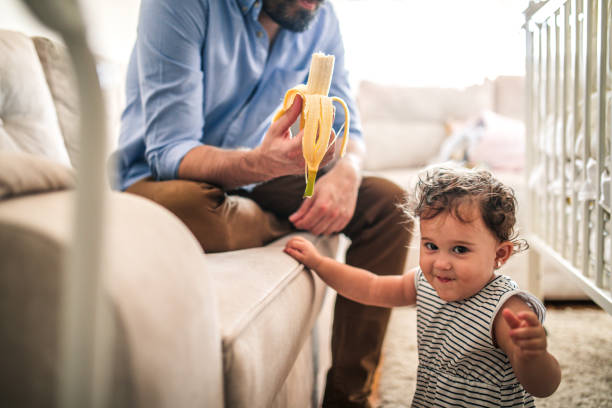 istock A father plays with his baby daughter in quarantine 1266238556