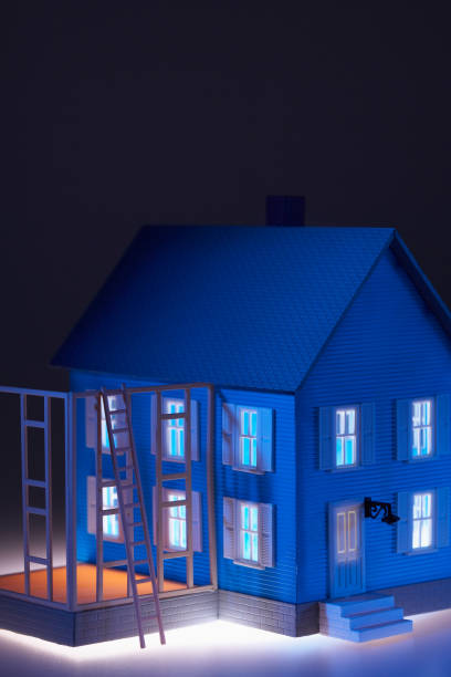 istock Model of house with ladder close-up 1266242521