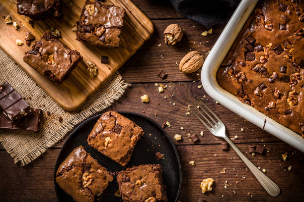 istock Homemade chocolate brownie on a rustic wooden table 1266242554