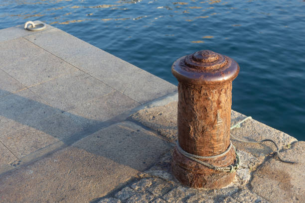 istock Rusty bollard on a fishing port pier 1266244161