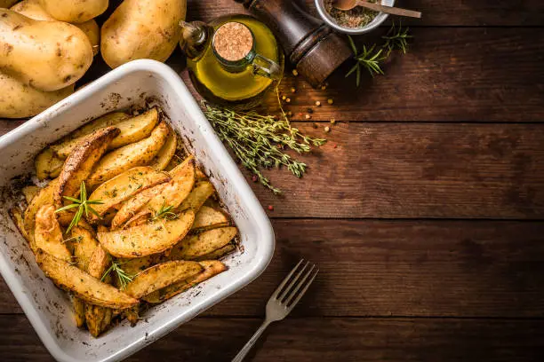 Photo of Baked potatoes on a baking sheet