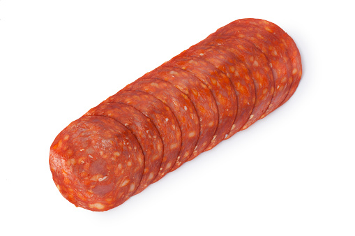 Studio shot of slices of chorizo cut out against a white background.