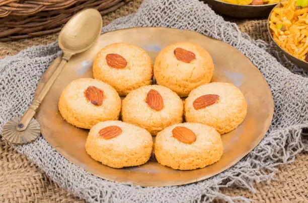Healthy Homemade Sweet Almond Cookies or biscuits Also Know as Nan Khatai on vintage background