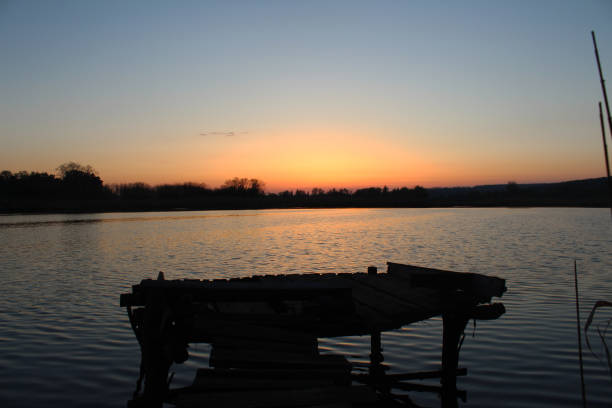 istock beautiful sunset on the river 1266252856