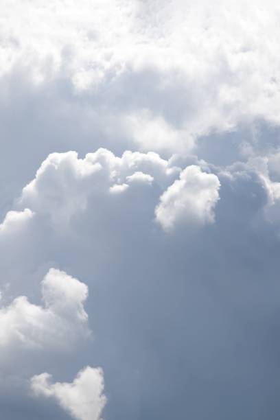 istock Gray and white fluffy clouds in the pale sky. Beautiful sky 1266254708