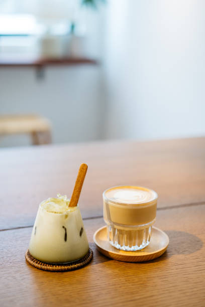 Cafe latte and hojicha latte on top of table