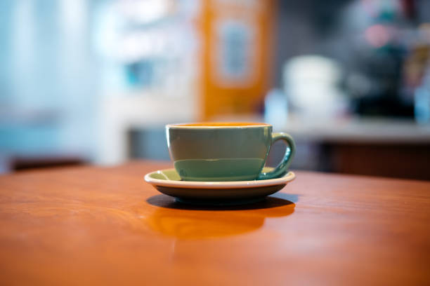 istock Flat white coffee on top of wooden table 1266256012