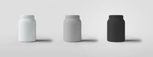 istock Template of white, gray, black cans with a screw cap, standing against a background with shadows. 1266257554