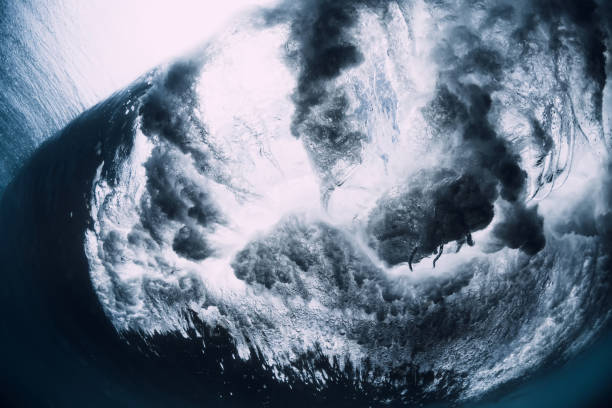 istock Crashing wave with foam and air bubbles underwater. Transparent ocean water 1266258215