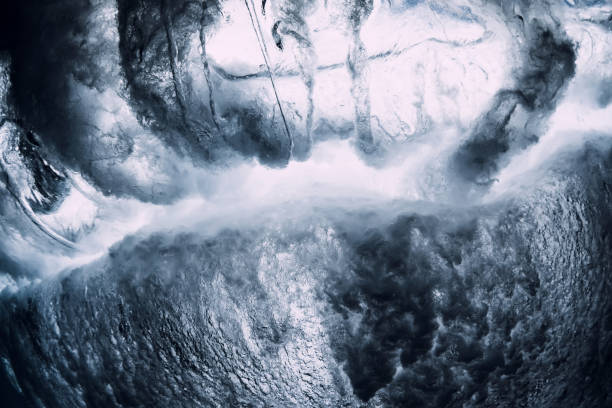 istock Crashing wave with foam and air bubbles underwater. Transparent ocean water 1266258312