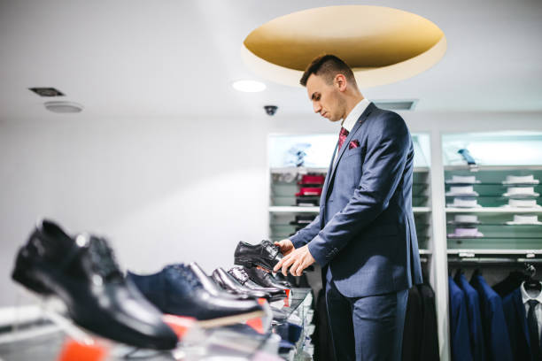 istock Man buying shoes 1266259628