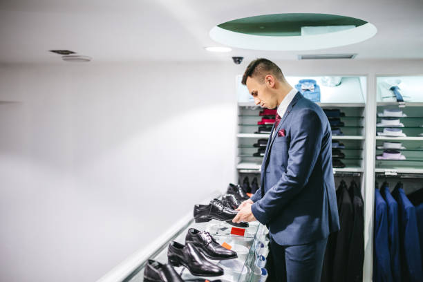 istock Man buying shoes 1266259653