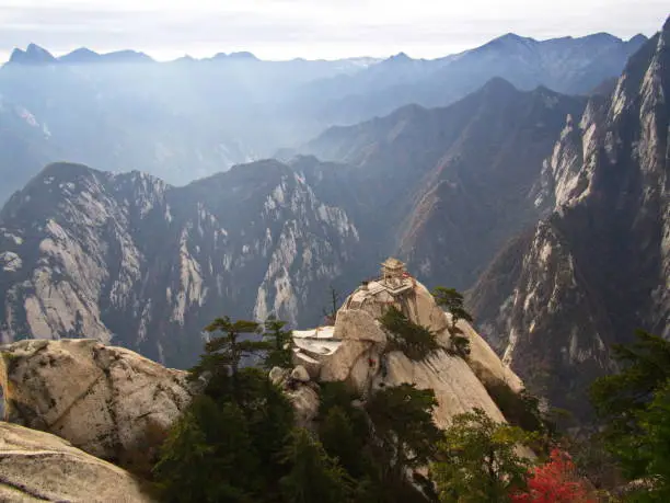 Photo of Huashan Mountain near Xian City. The Most dangerous Trail and Crowned People in China. Mount Hua is one of the Five Great Mountains of China in Huayin City, Shaanxi Province, China, 18th October 2018