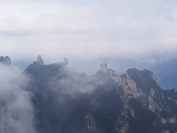 Photo of Huashan Mountain near Xian City. The Most dangerous Trail and Crowned People in China. Mount Hua is one of the Five Great Mountains of China in Huayin City, Shaanxi Province, China, 18th October 2018