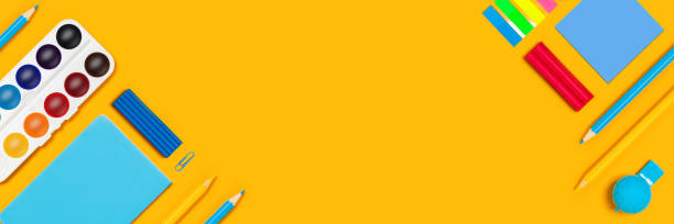 istock Yellow paper with writing materials. 1266264056