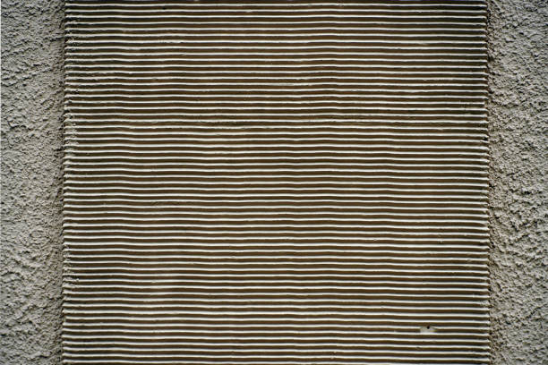A background of a concrete wall with a metal striped surface, simple concept with negative space.