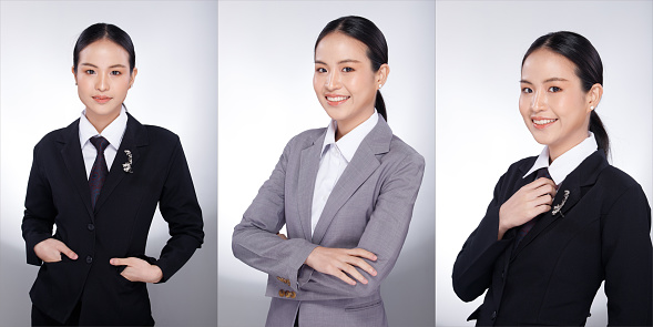 Half body portrait of 20s Asian Woman black hair gray suit jacket. Office girl poses many look and smile over white Background isolated