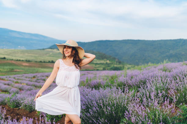 istock Young joyful woman in lavender field 1266268530