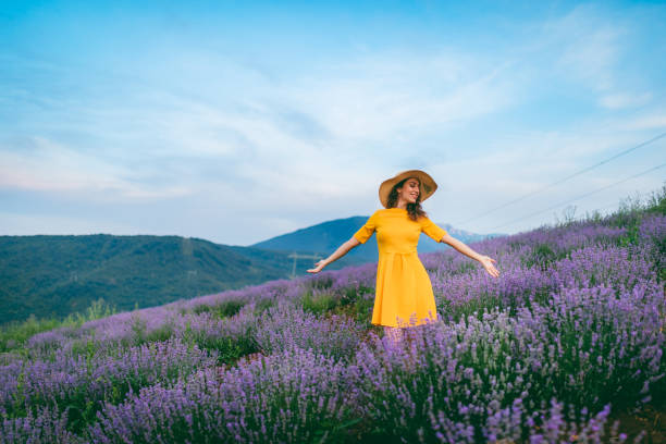 istock Young joyful woman in lavender field 1266268605