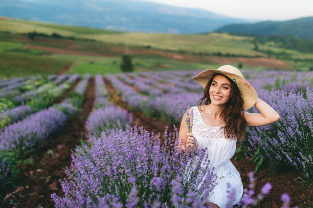istock Young joyful woman in lavender field 1266269307