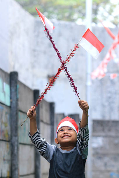 istock An elementary school child carrying an Indonesian flag 1266269331