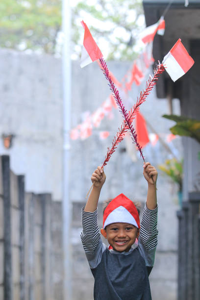istock An elementary school child carrying an Indonesian flag 1266269535