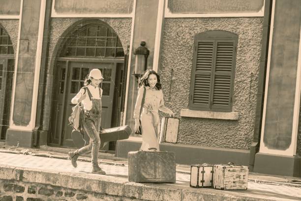 istock Young girlfriends with a suitcase travel 1266271157