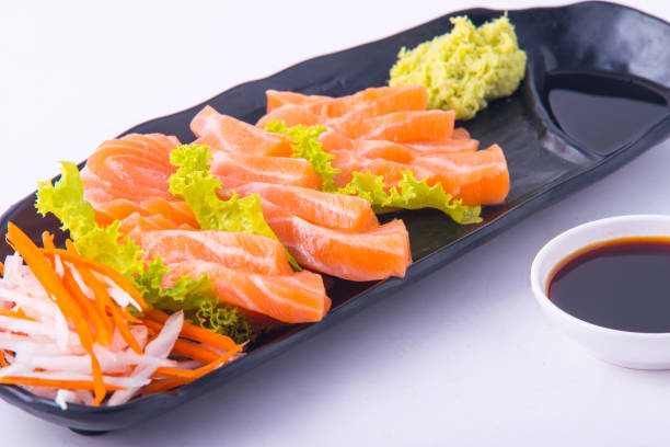 istock Salmon sashimi on black dish at restuarant 1266274590
