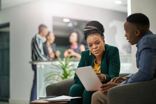 istock African Businesspeople Brainstorming In Office Lobby 1266274675