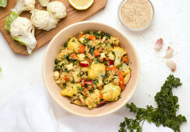 istock Fresh salad with stewed cauliflower and quinoa next to the ingredients 1266275368