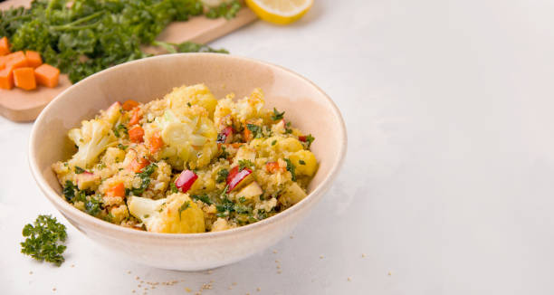 istock Vegan salad with cauliflower on a white plate. Copy space. Banner 1266275395