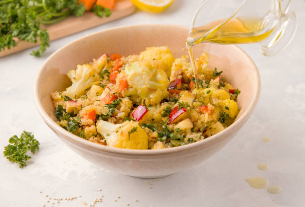 istock Vegetarian salad with quinoa and cauliflower on a light background 1266275402