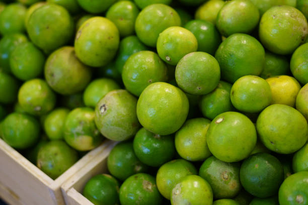 istock Tropical lime fruit on greengrocery fruit shop 1266276916