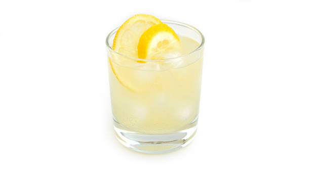 istock Glass with lemon lemonade and ice on a white background 1266277916