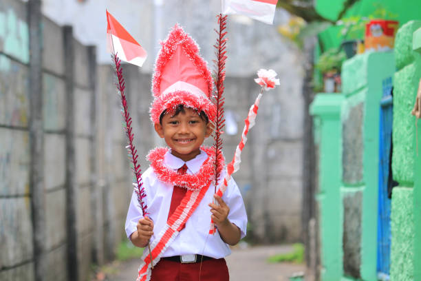 istock An elementary school child carrying an Indonesian flag 1266279166