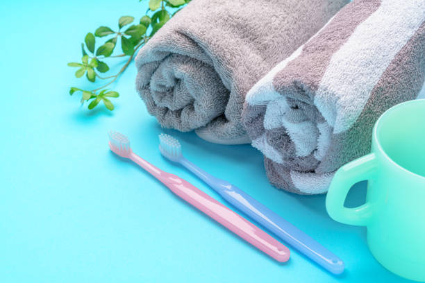 The toothbrushes, cup and towel The toothbrushes, cup and towel bad breath couple stock pictures, royalty-free photos & images