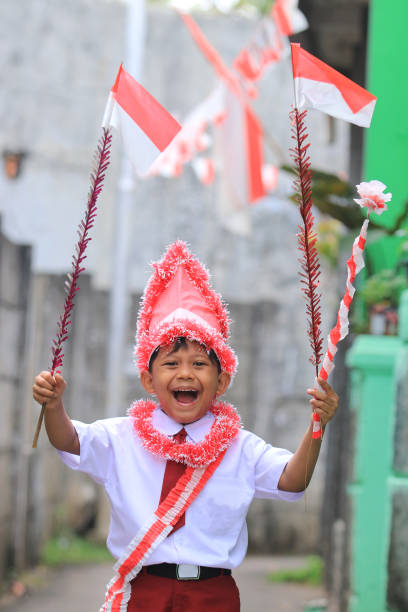 istock An elementary school child carrying an Indonesian flag 1266280469