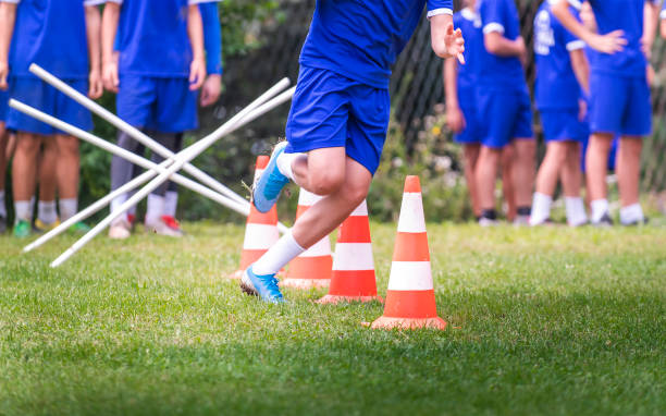 istock Young Soccer Players at Speed and Agility Practice Session 1266280576