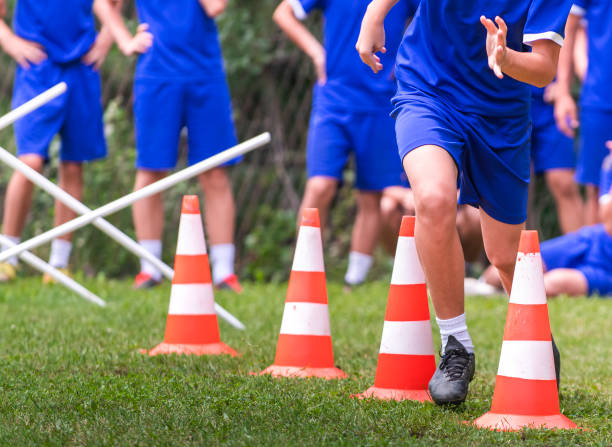 istock Young Soccer Players at Speed and Agility Practice Session 1266280579