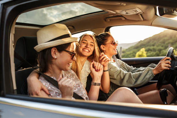 Summer adventure Three best female friends travel together.They drives a car and making fun.Summer adventure.. friends stock pictures, royalty-free photos & images