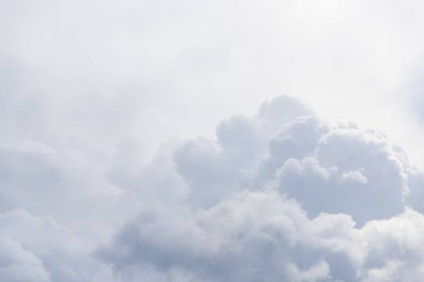 istock Gray and white fluffy clouds in the pale sky. Beautiful sky 1266282197