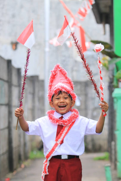istock An elementary school child carrying an Indonesian flag 1266285493