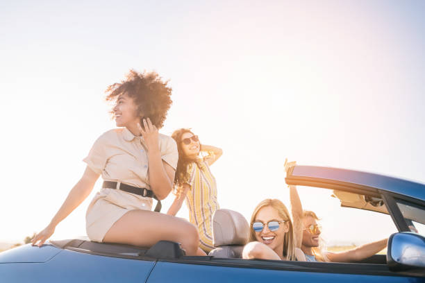 istock Girlfriends having fun on road trip 1266285633